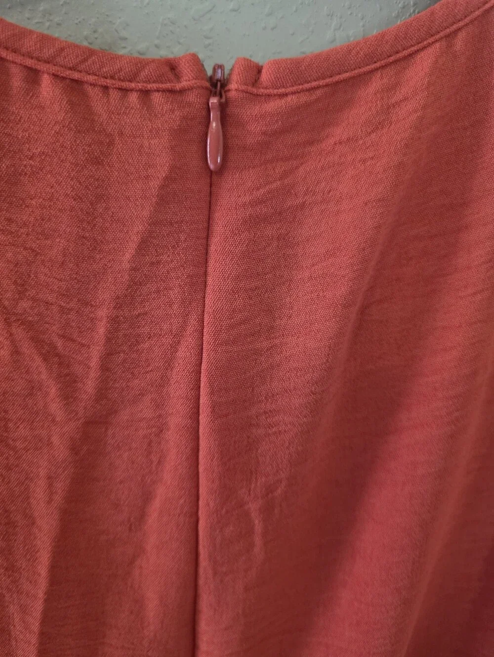 Orange Women’s Romper. V-Neck Textured. Hidden Zipper On Back.